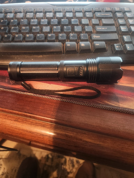 Rob's own rechargeable LED flashlight with its wrist lanyard