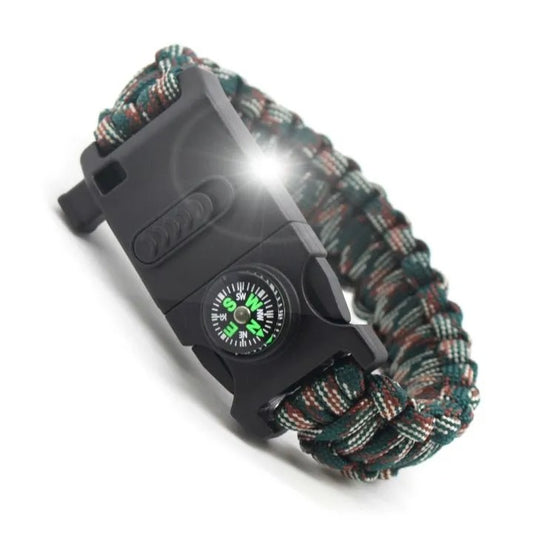 Camo paracord bracelet with built-in light switched on and compass